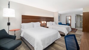 A hotel room with two beds, a desk, a chair, a lamp, and a mirror. - Holiday Inn Express & Suites Dinuba West by IHG (Dinuba)