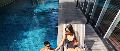 Outdoor pool, open 7:00 AM to 8:00 PM, pool umbrellas, pool loungers