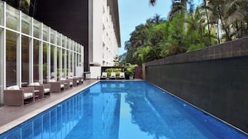 Outdoor pool, open 7:00 AM to 8:00 PM, pool umbrellas, pool loungers