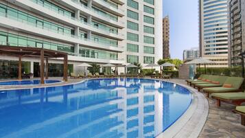 Outdoor pool, open 8:00 AM to 9:00 PM, lifeguards on site