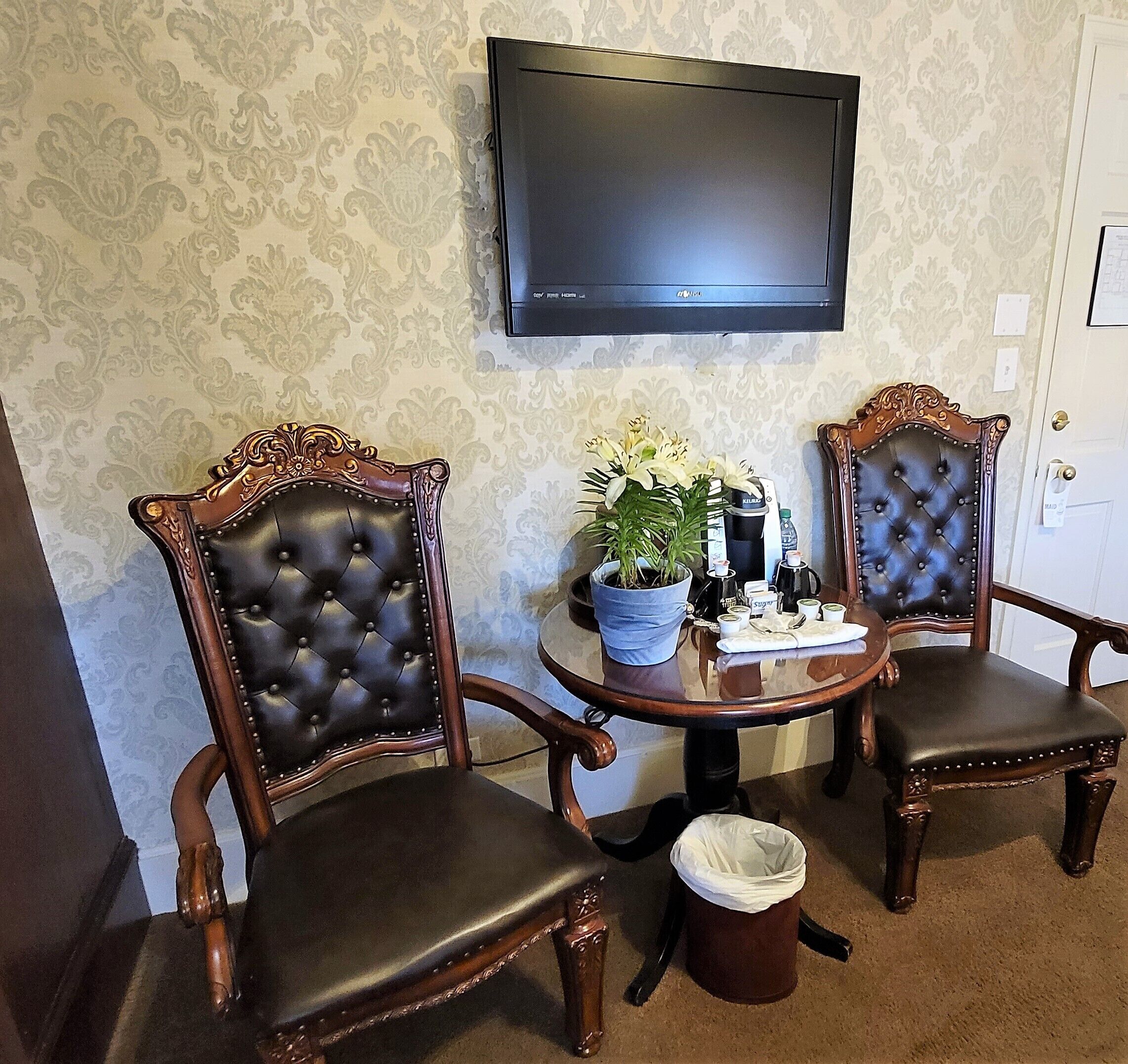 room 305-queen bed with windows | living area | 42-inch flat-screen tv with cable channels, tv, ipod dock