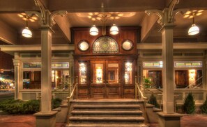 A grand entrance with a wooden staircase, a stained glass window, and a sign reading "General Palmer Hotel". - The General Palmer Hotel (Durango)