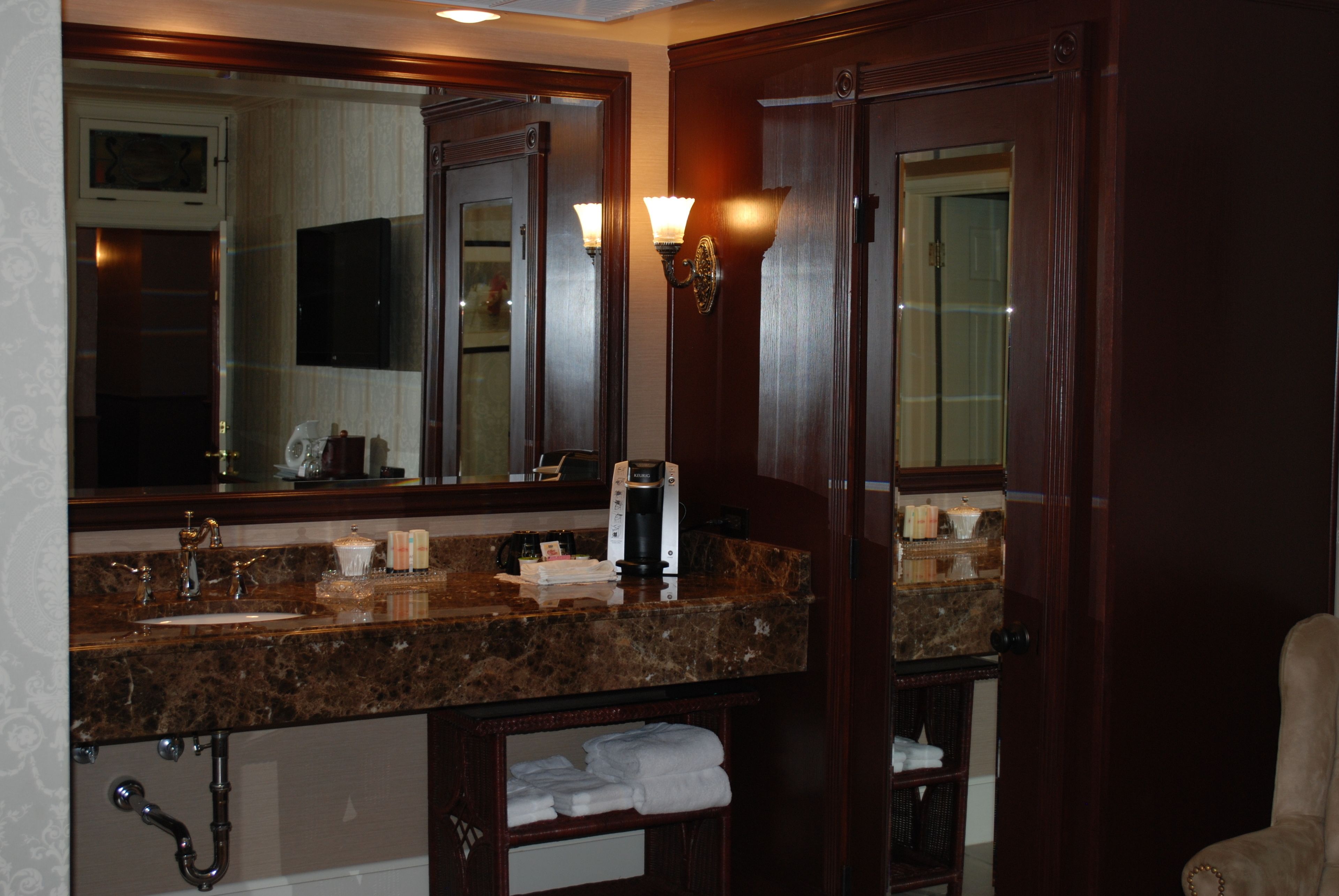 room 208-queen bed no windows | bathroom | combined shower/bathtub, hydromassage showerhead, designer toiletries