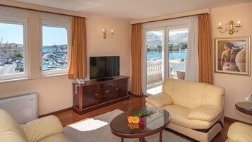 Deluxe Apartment, 2 Bedrooms, Terrace | Living area | Flat-screen TV