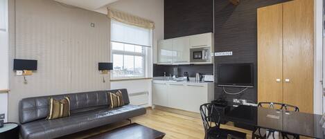 Triple Studio | Private kitchen | Full-sized fridge, microwave, oven, stovetop