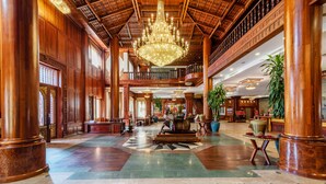 A spacious lobby with high wooden ceilings, a large chandelier, and a central seating area. - Empress Angkor Resort & Spa (Siem Reap)