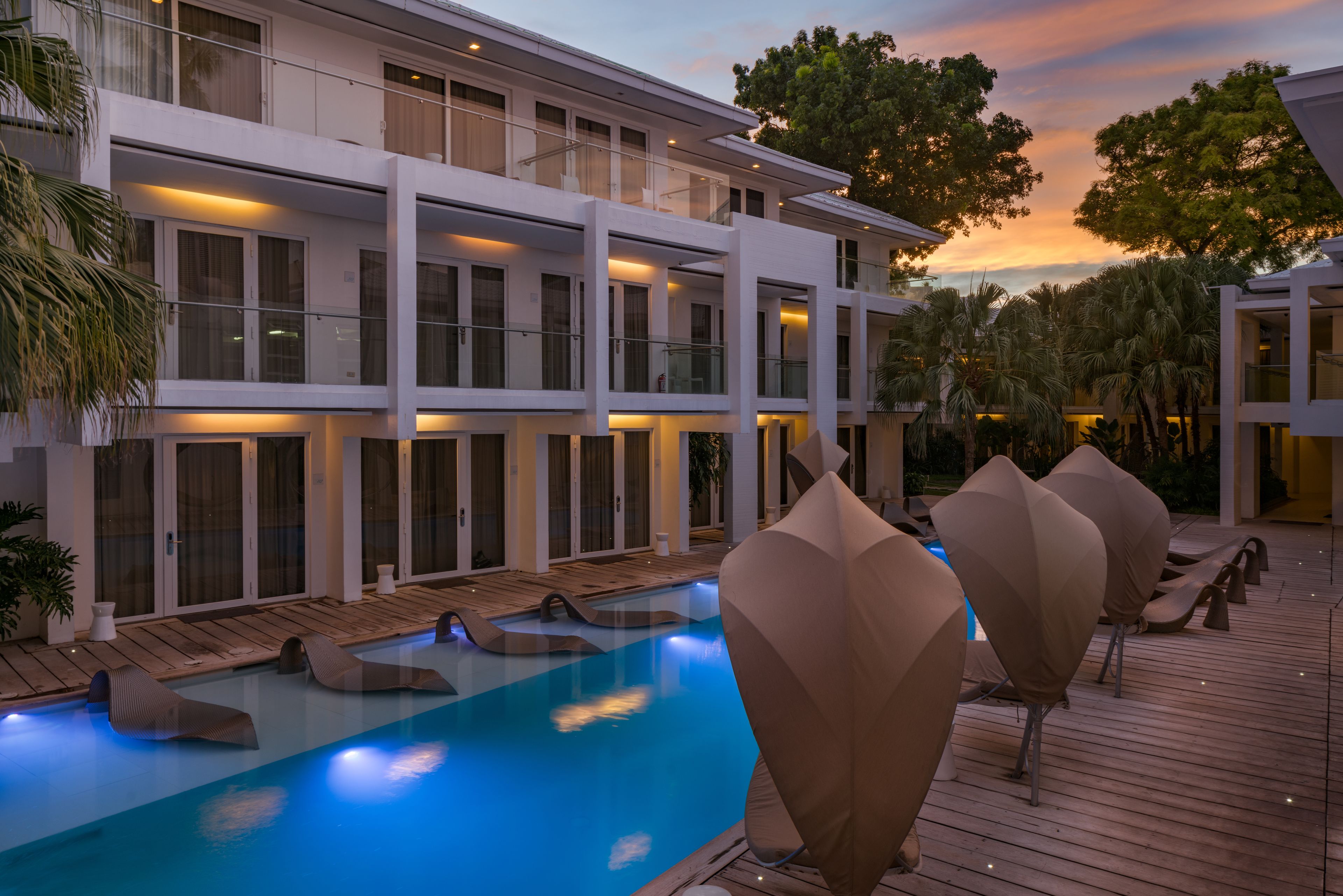 outdoor pool, open 8:00 am to 9:00 pm, pool umbrellas, pool loungers