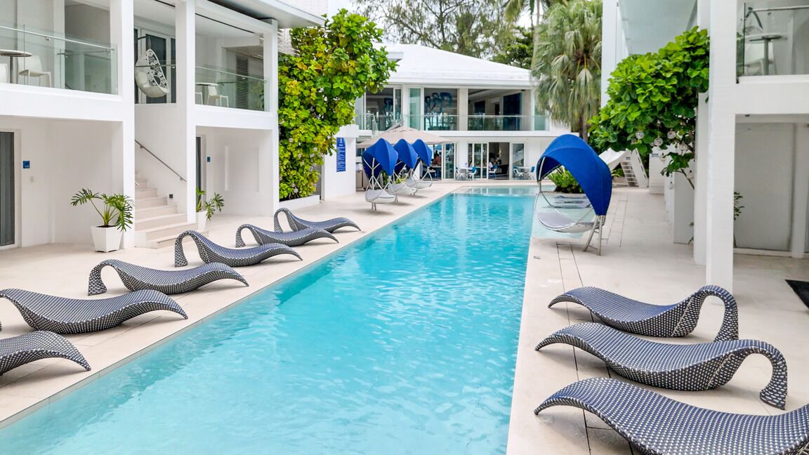 Outdoor pool, open 8:00 AM to 9:00 PM, pool umbrellas, pool loungers