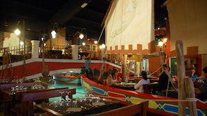 A restaurant with a nautical theme, featuring a large ship-shaped boat as a dining area. - Autohotel Venezia (Mirano)