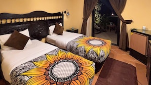 A double bed with a headboard, two pillows, and a patterned bedspread. - Dahab Paradise (Dahab)