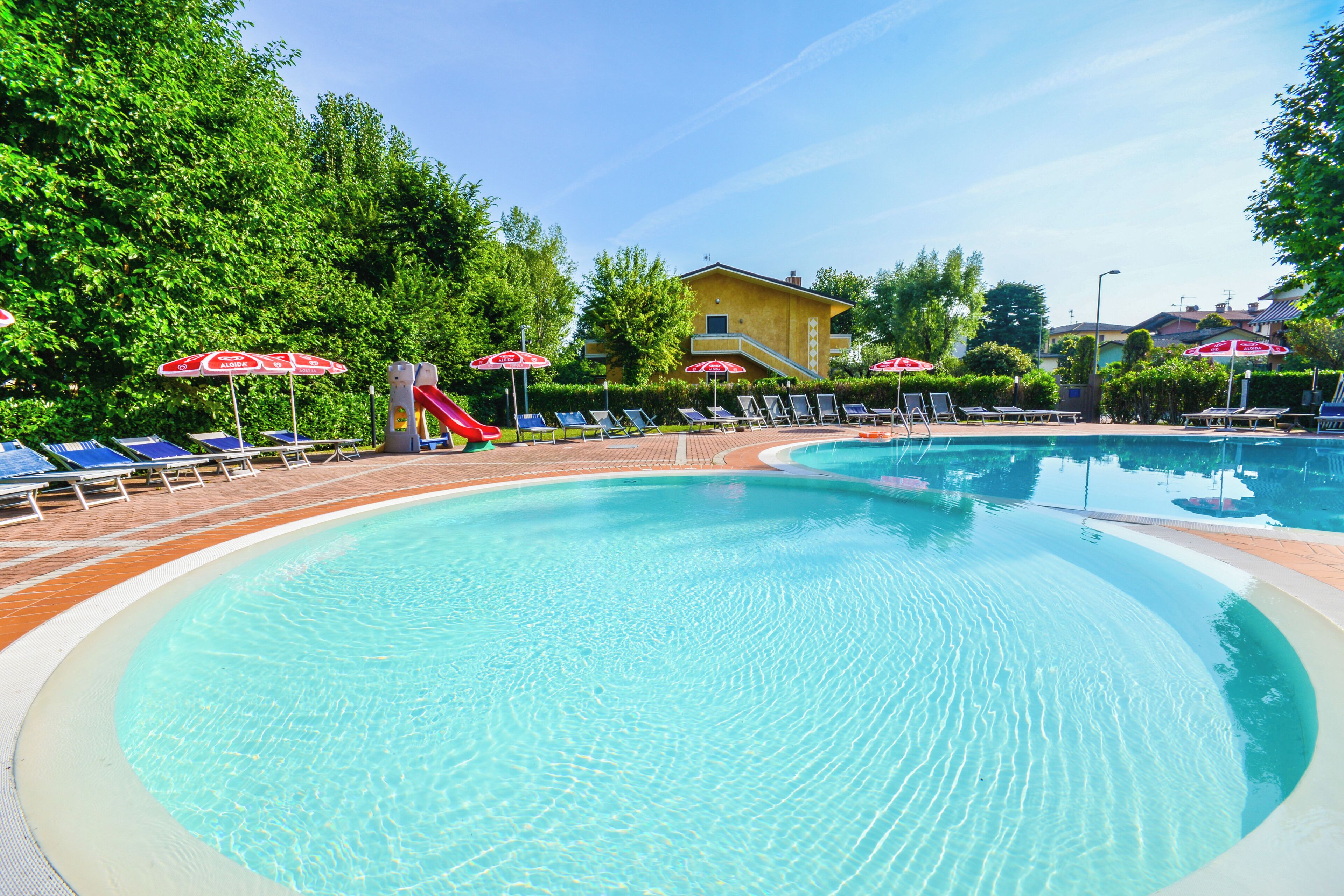 Seasonal outdoor pool, open 8:00 AM to 8:00 PM, pool umbrellas