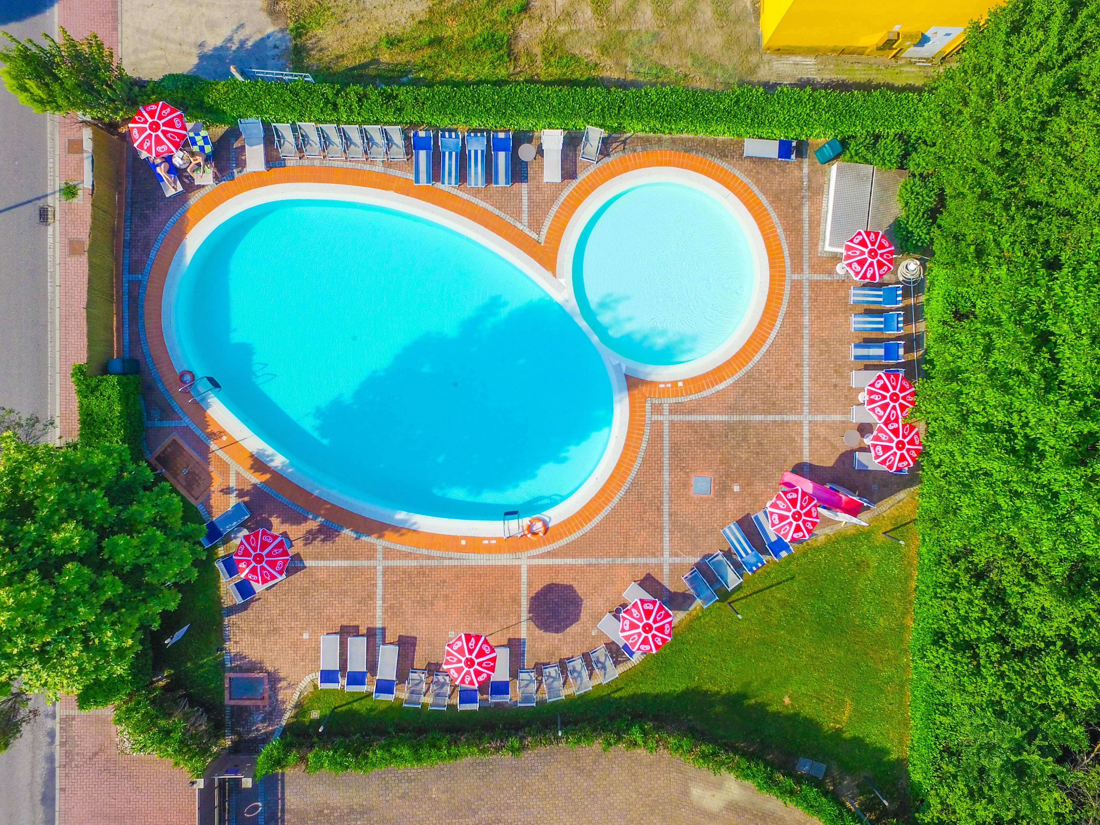 seasonal outdoor pool, open 8:00 am to 8:00 pm, pool umbrellas