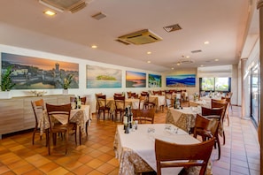 Breakfast, lunch, dinner served; Italian cuisine, al fresco dining