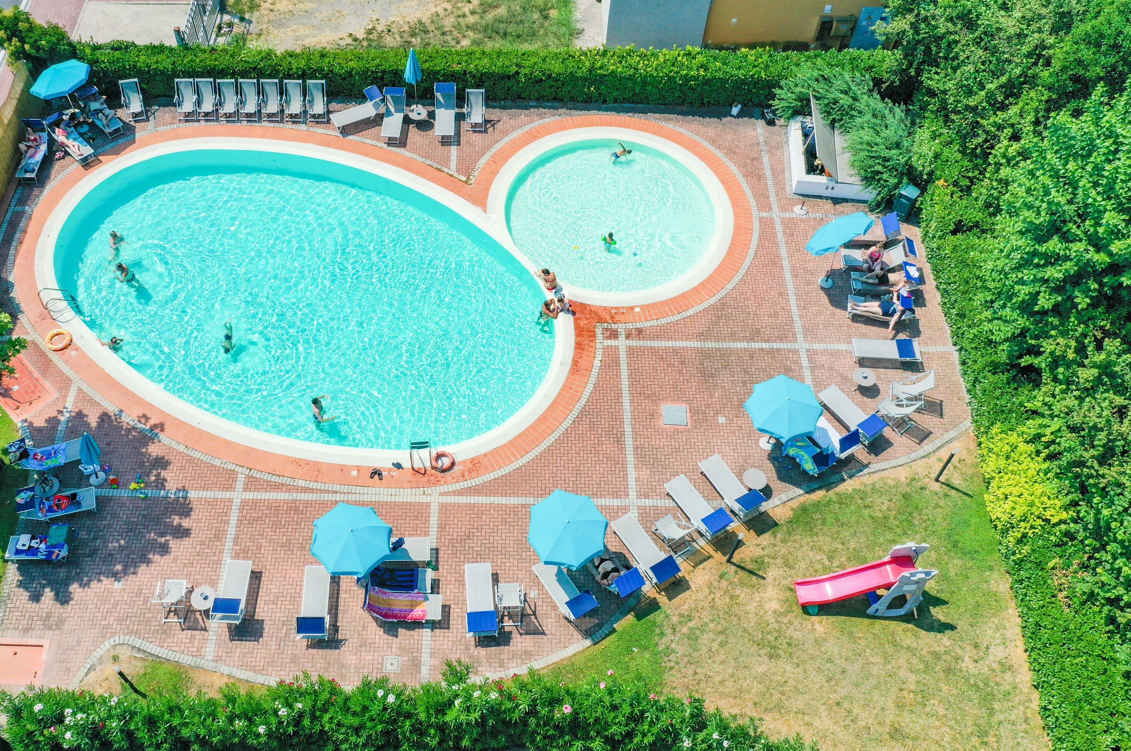 Seasonal outdoor pool, open 8:00 AM to 8:00 PM, pool umbrellas