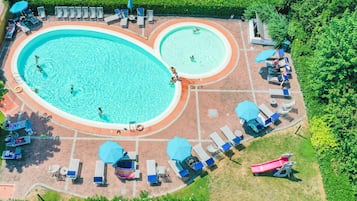 Seasonal outdoor pool, open 8:00 AM to 8:00 PM, pool umbrellas
