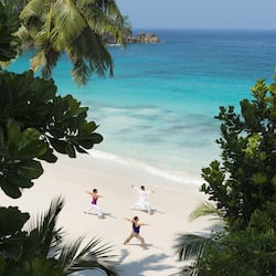 On the beach, white sand, beach yoga, beach volleyball