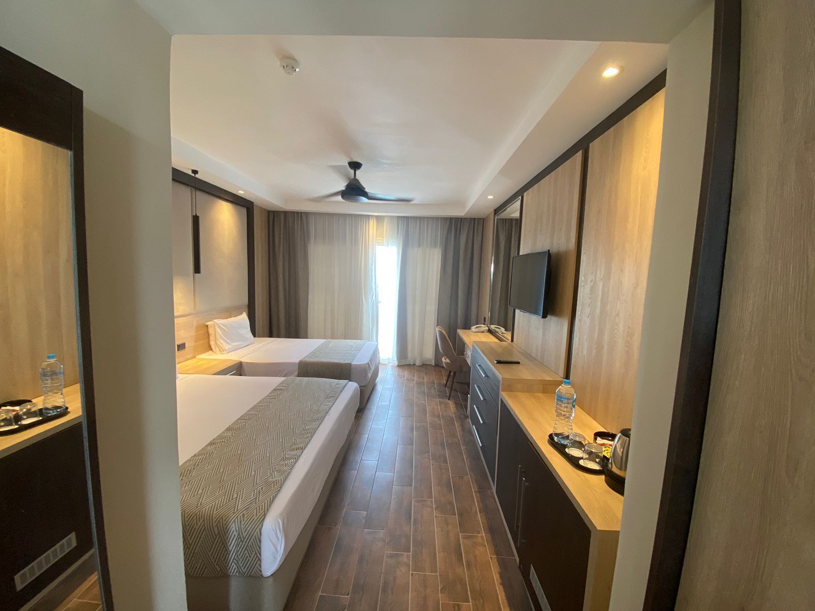 Deluxe Double or Twin Room, Pool View | Free minibar items, in-room safe, blackout curtains