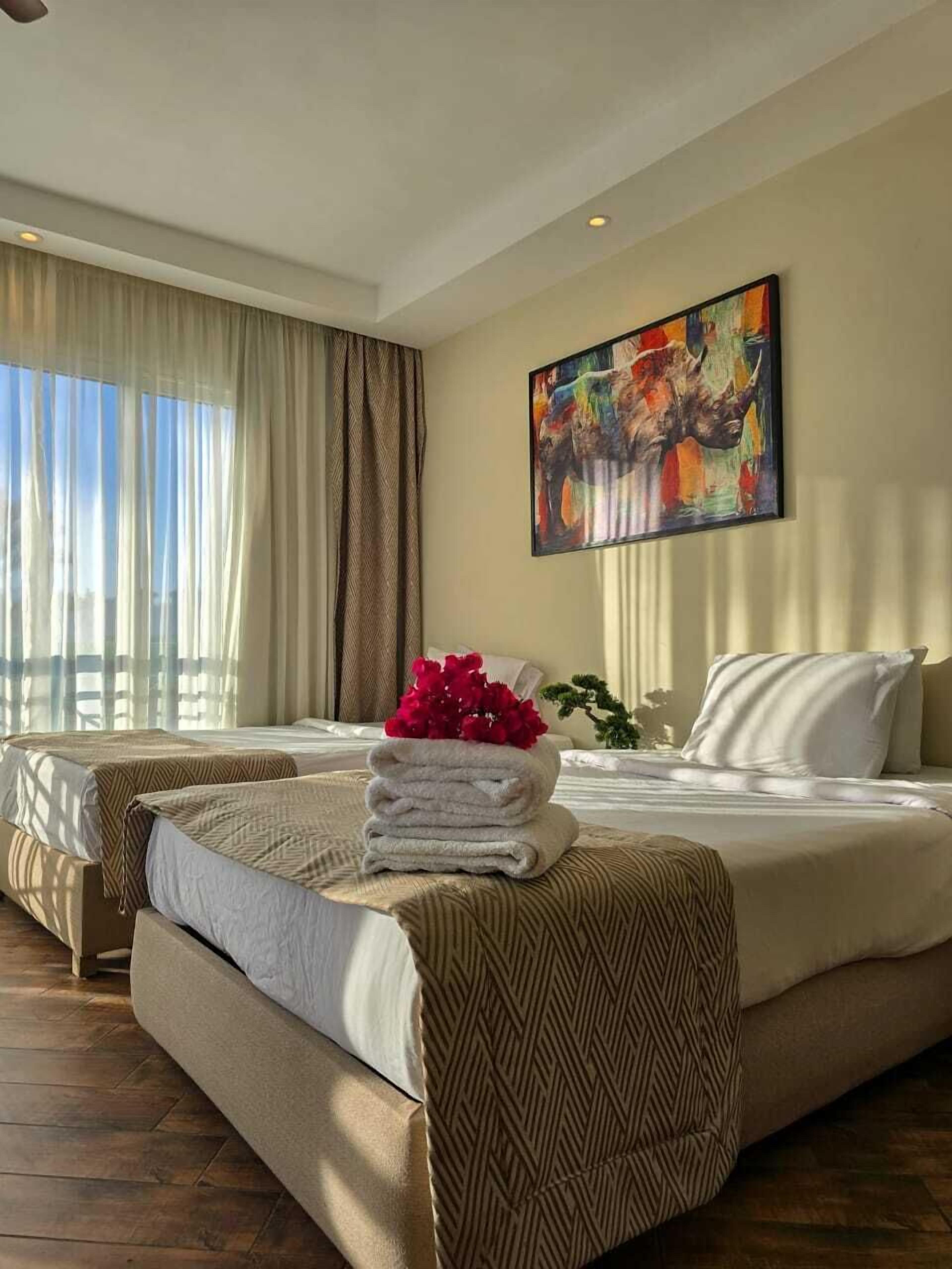 Deluxe Double or Twin Room, Garden View | Free minibar items, in-room safe, blackout curtains, iron/ironing board