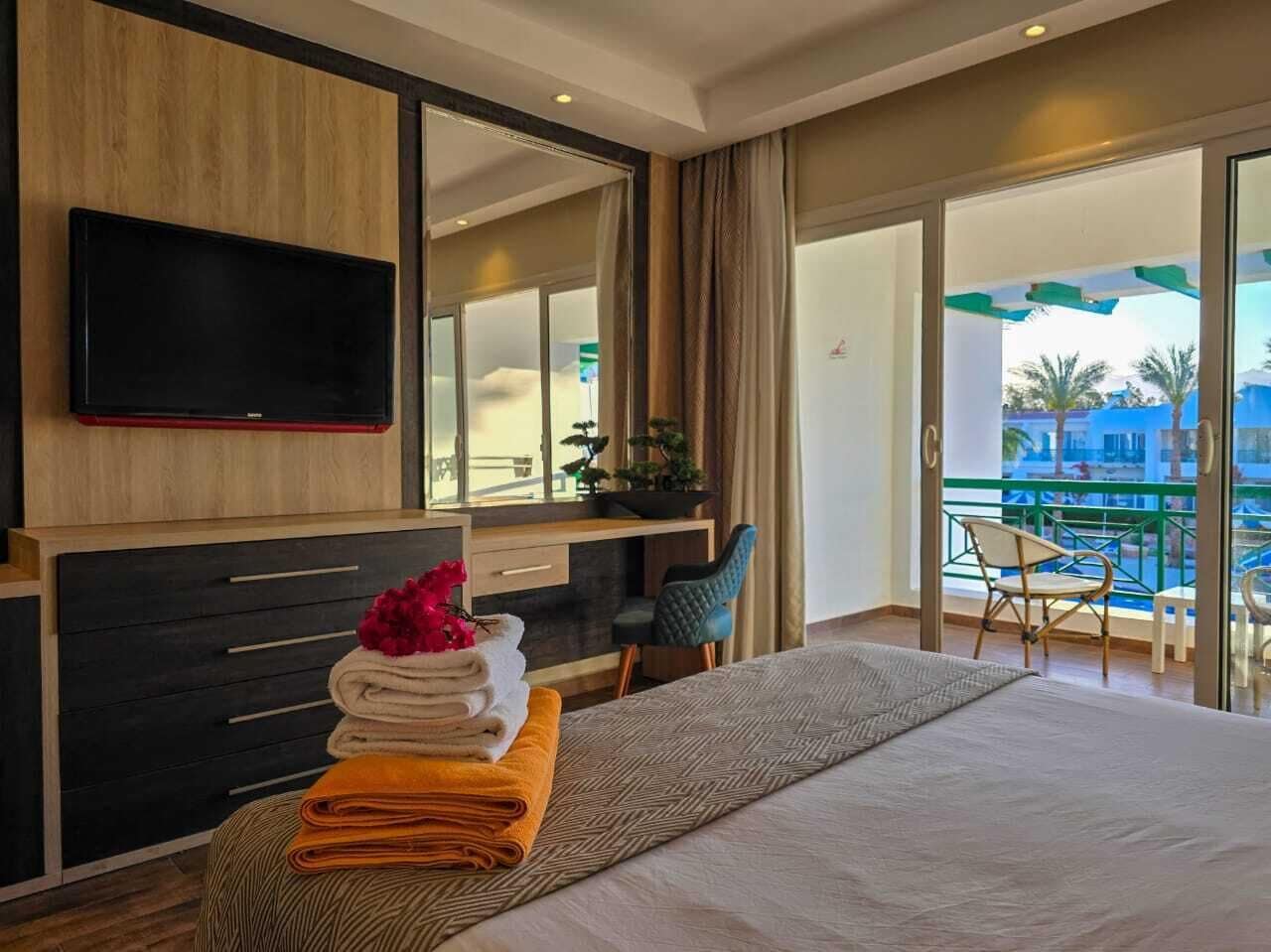 Deluxe Double or Twin Room, Pool View | Free minibar items, in-room safe, blackout curtains, iron/ironing board