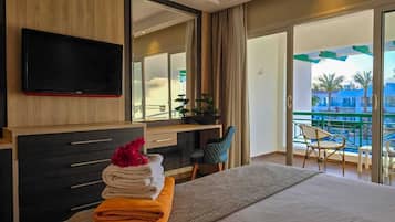 Deluxe Double or Twin Room, Pool View | Free minibar items, in-room safe, blackout curtains, iron/ironing board