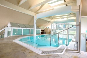 Indoor pool, open 8:00 AM to 9:00 PM, pool loungers