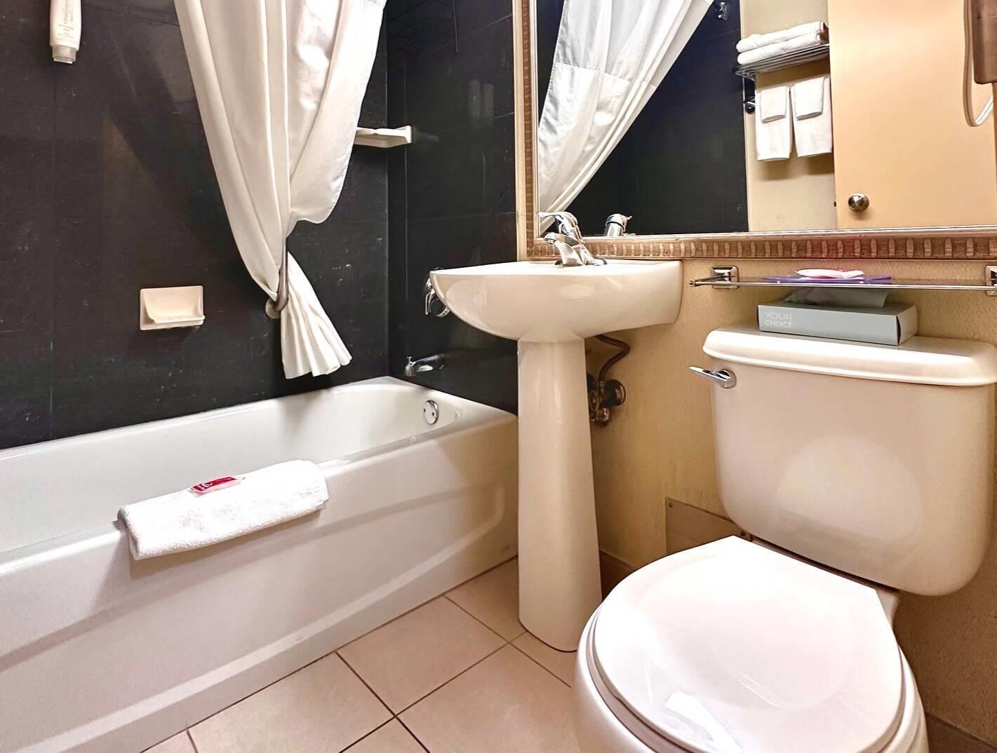 Suite, 1 King Bed, Non Smoking | Desk, laptop workspace, iron/ironing board, free WiFi