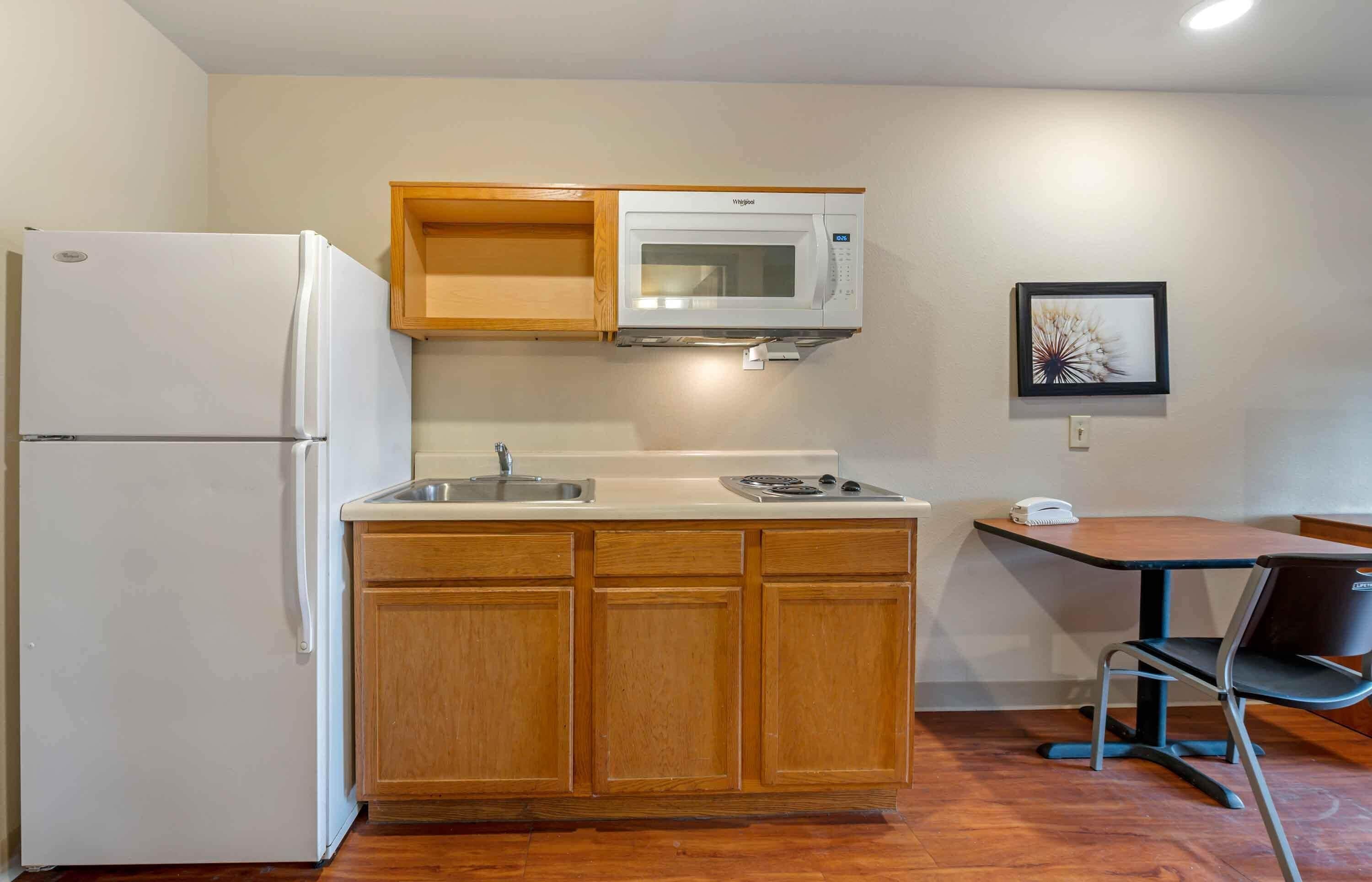 Full-sized fridge, microwave, stovetop, freezer