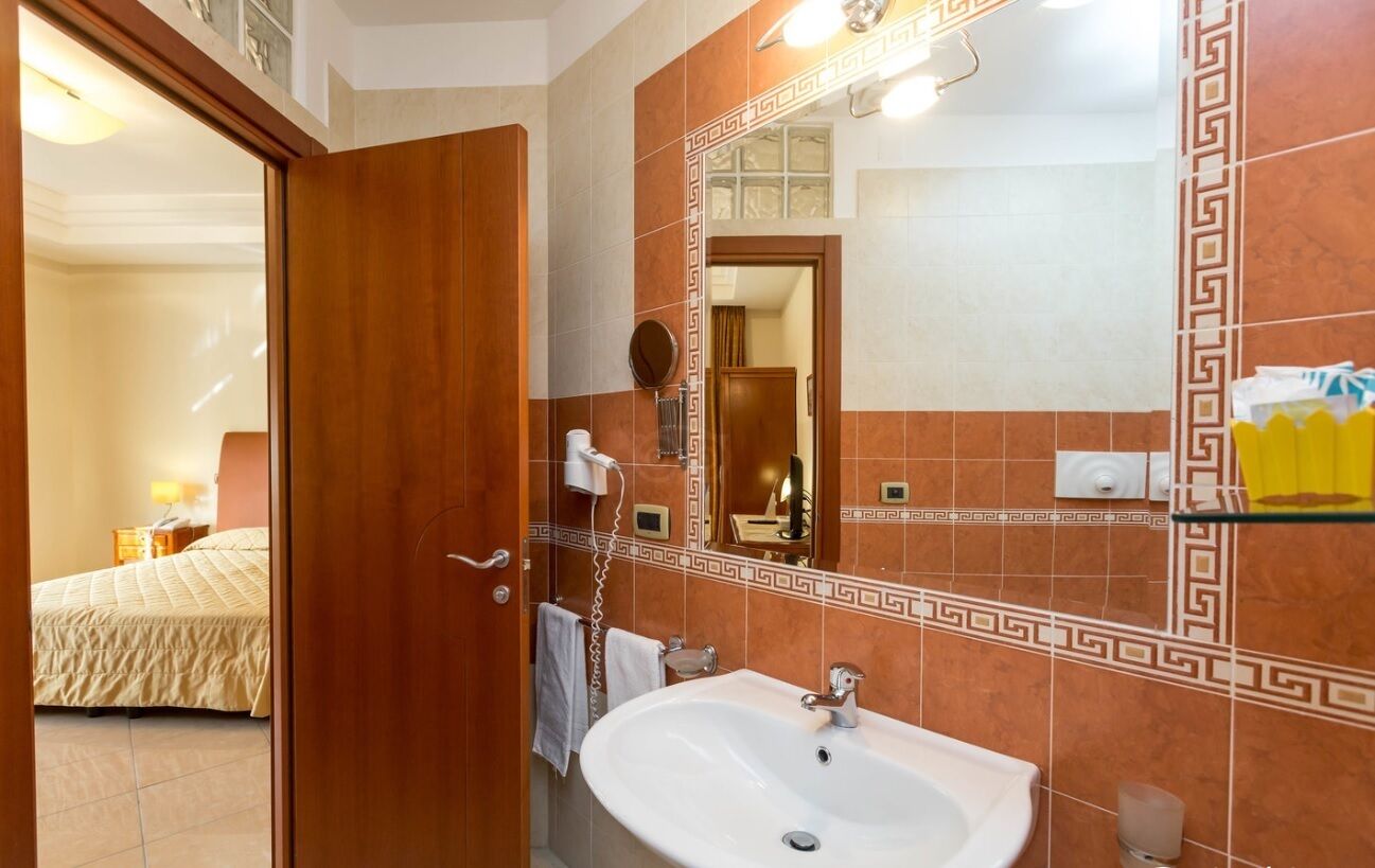 shower, hair dryer, bathrobes, slippers