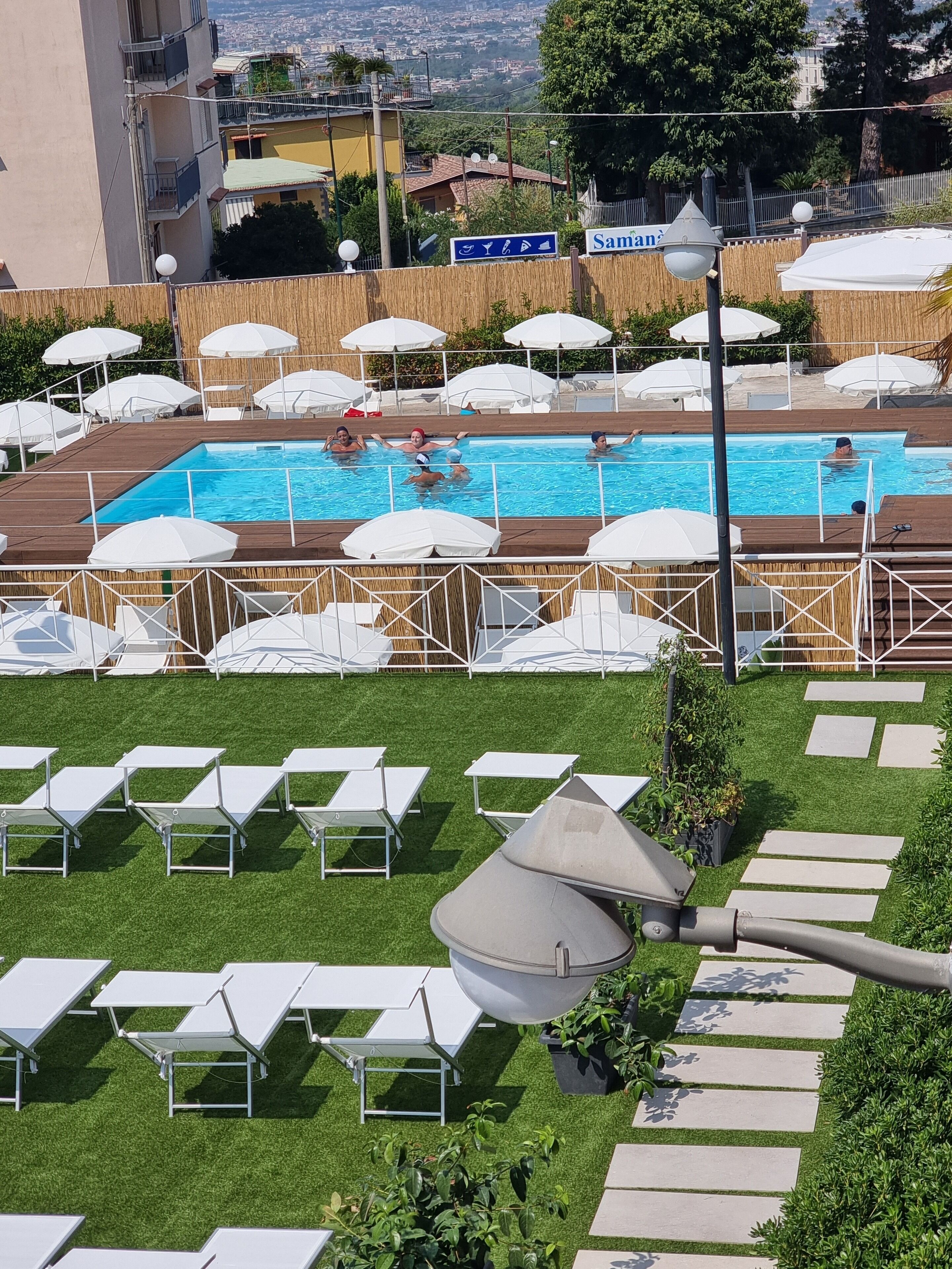 seasonal outdoor pool, open 10:00 am to 6:00 pm, pool umbrellas