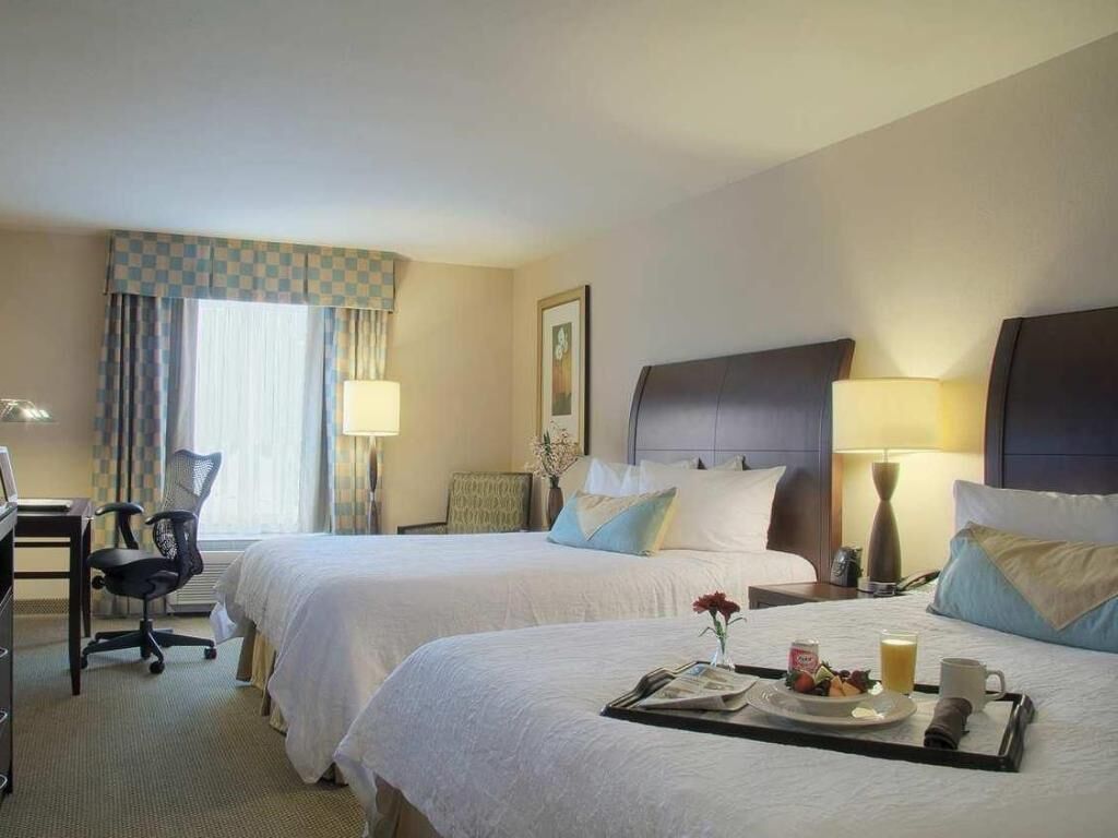 Premium bedding, laptop workspace, blackout curtains, iron/ironing board