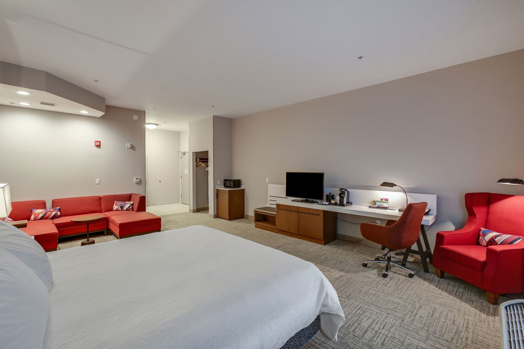 Premium bedding, laptop workspace, blackout curtains, iron/ironing board
