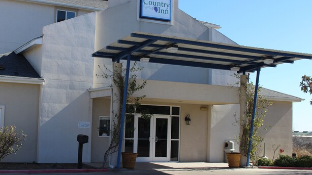 A building with a sign reading "Wine Country Inn."