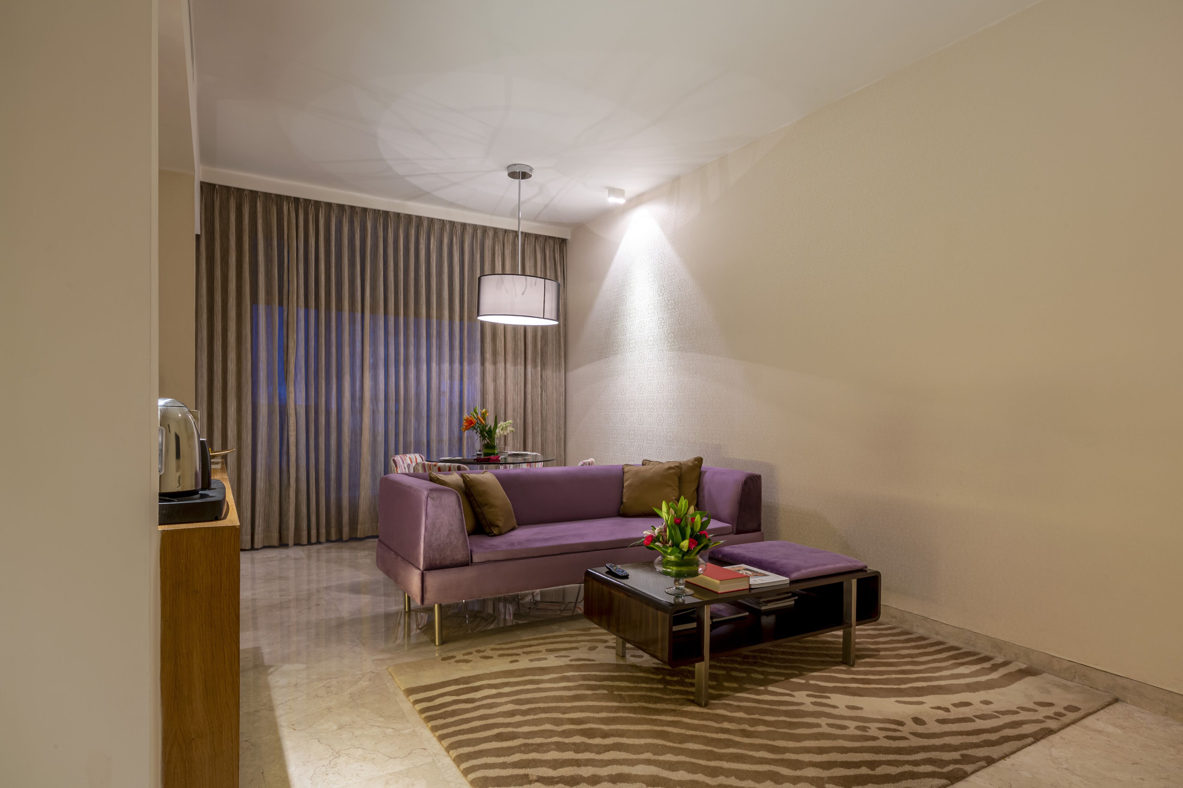 premium suite pool view king bed | living room | 42-inch led tv with digital channels, dvd player, pay films