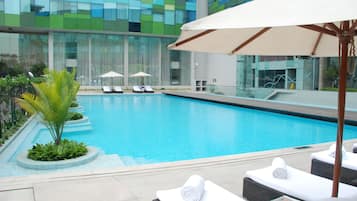 Outdoor pool, pool umbrellas, sun loungers