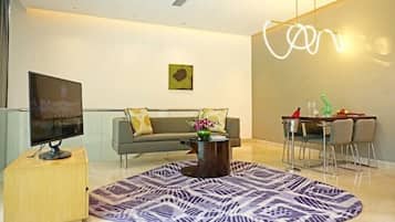 Suite, 1 King Bed, Pool View (Vivanta) | Living area | 42-inch LED TV with digital channels, DVD player, pay movies