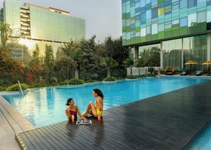 Outdoor pool, pool umbrellas, sun loungers