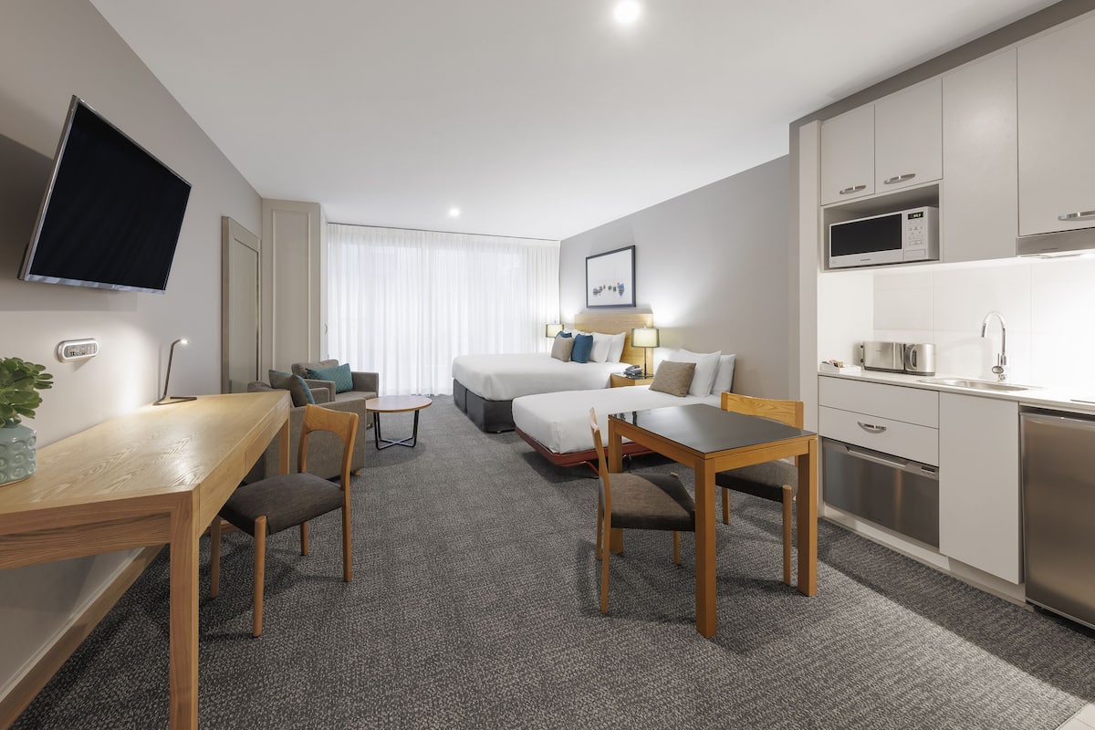 executive studio apartment | 1 bedroom, desk, laptop workspace, iron/ironing board