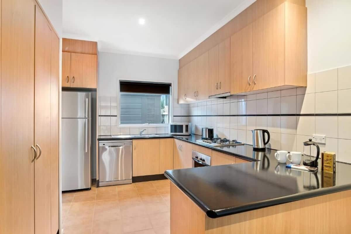 three bedroom townhouse | private kitchen | fridge, electric kettle, toaster, high chair