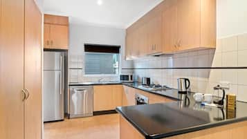Three Bedroom Townhouse | Private kitchen | Fridge, electric kettle, toaster, highchair