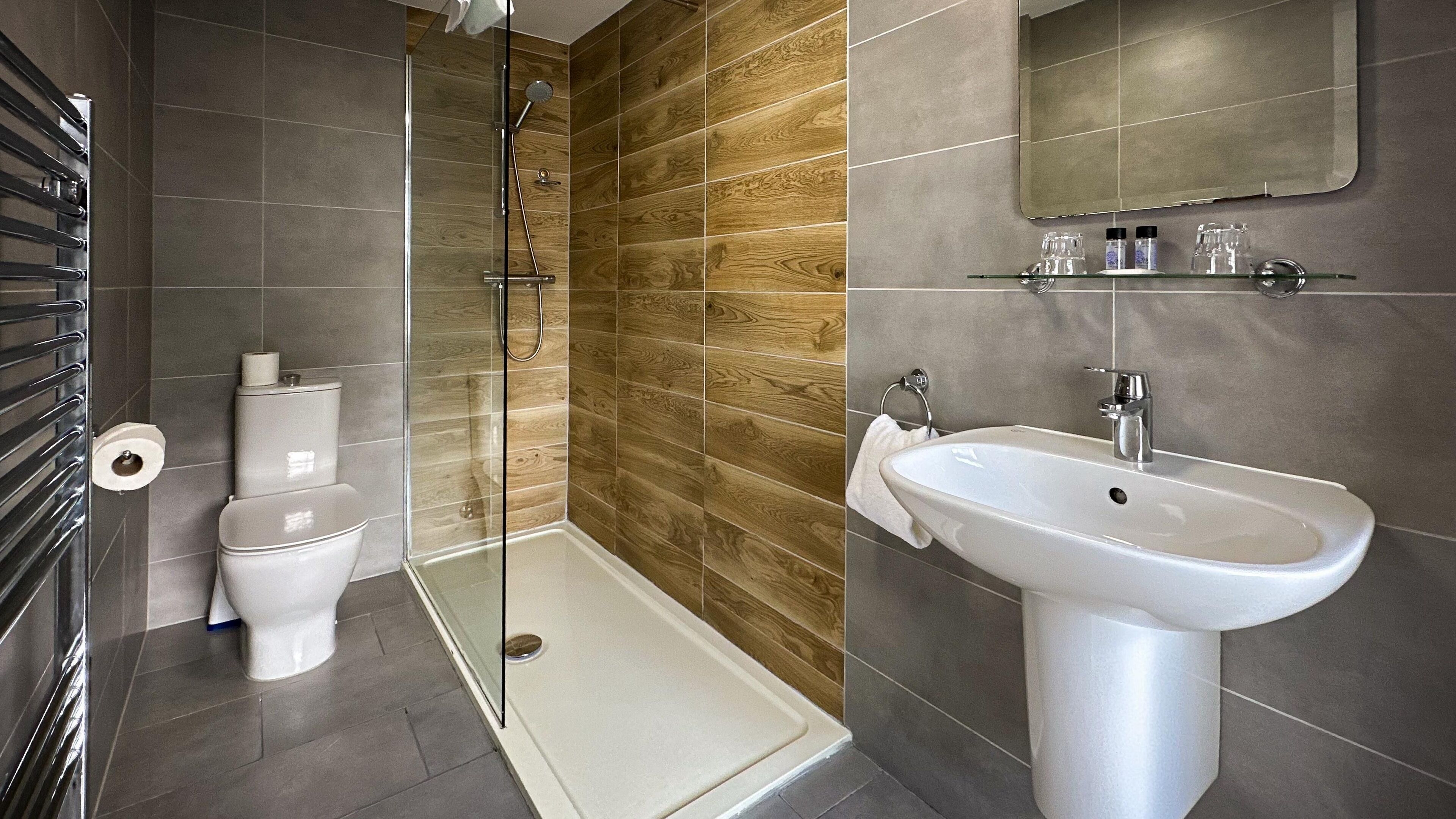 family room | bathroom | shower, free toiletries, hair dryer, towels