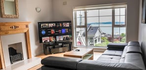 Suite Deluxe, 4 chambres, non-fumeur, vue océan | Coin séjour