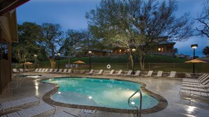 A swimming pool with lounge chairs and a no diving sign. - WorldMark New Braunfels (New Braunfels)
