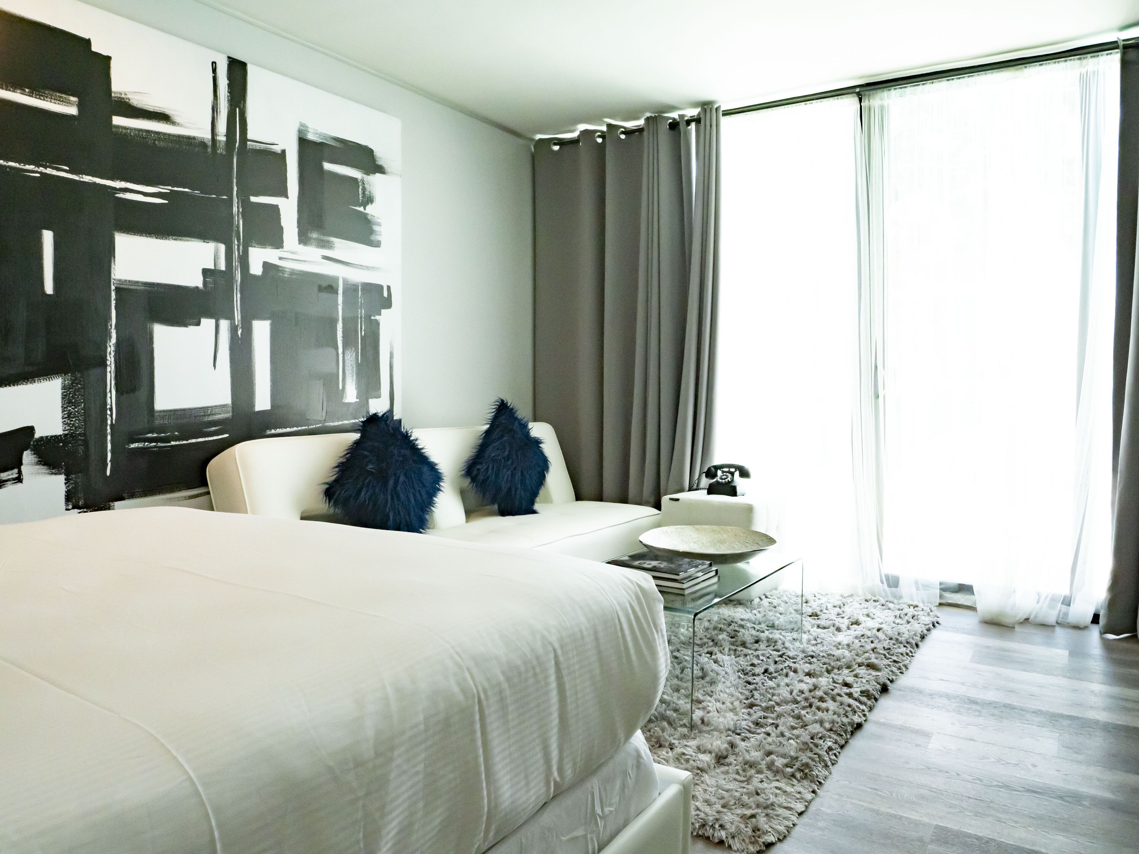 deluxe queen pool access | in-room safe, desk, laptop workspace, blackout curtains