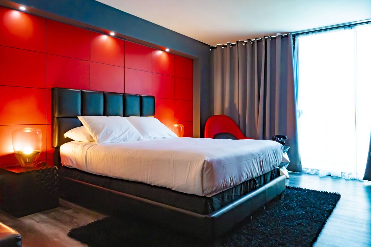 deluxe queen bed room (b2) | in-room safe, desk, laptop workspace, blackout curtains