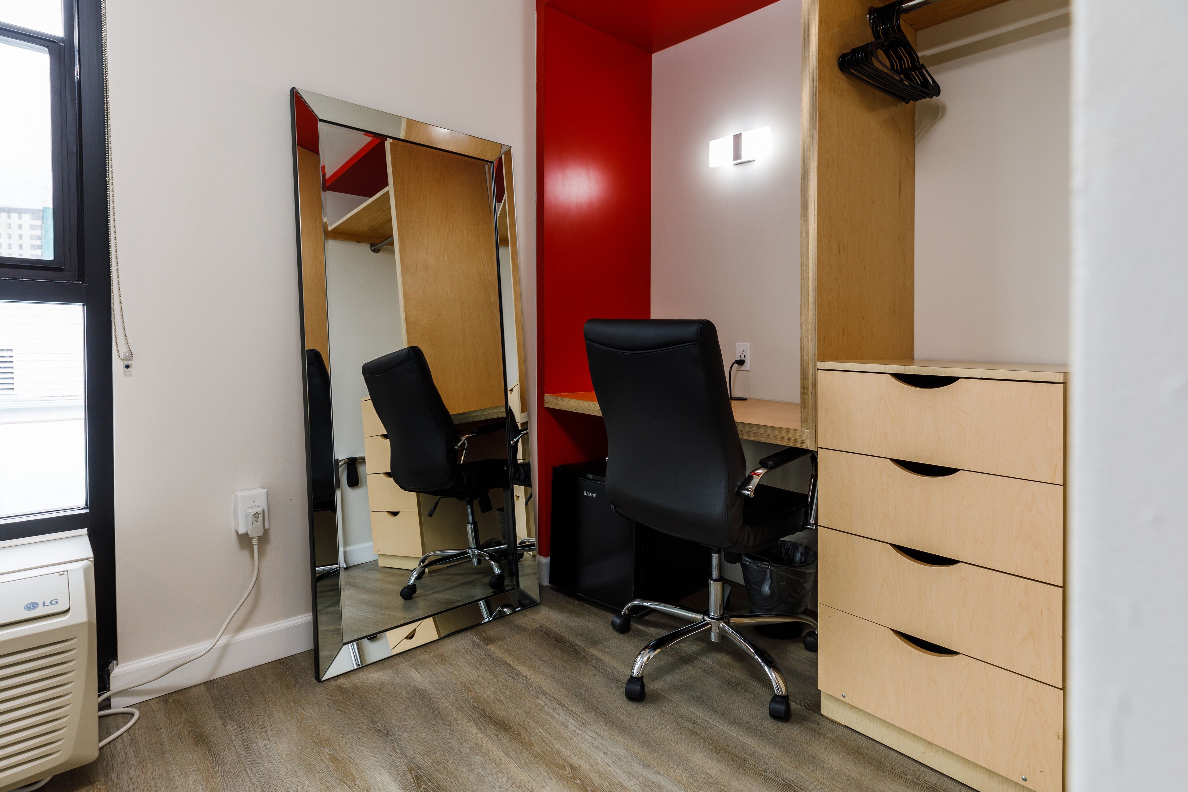 deluxe queen pool view | in-room safe, desk, laptop workspace, blackout curtains