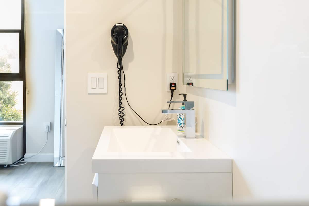 deluxe queen junior suite | bathroom | shower, rainfall showerhead, free toiletries, hair dryer