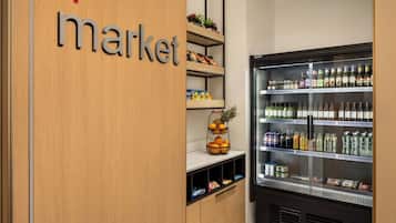 A refrigerated display case with various beverages and snacks.