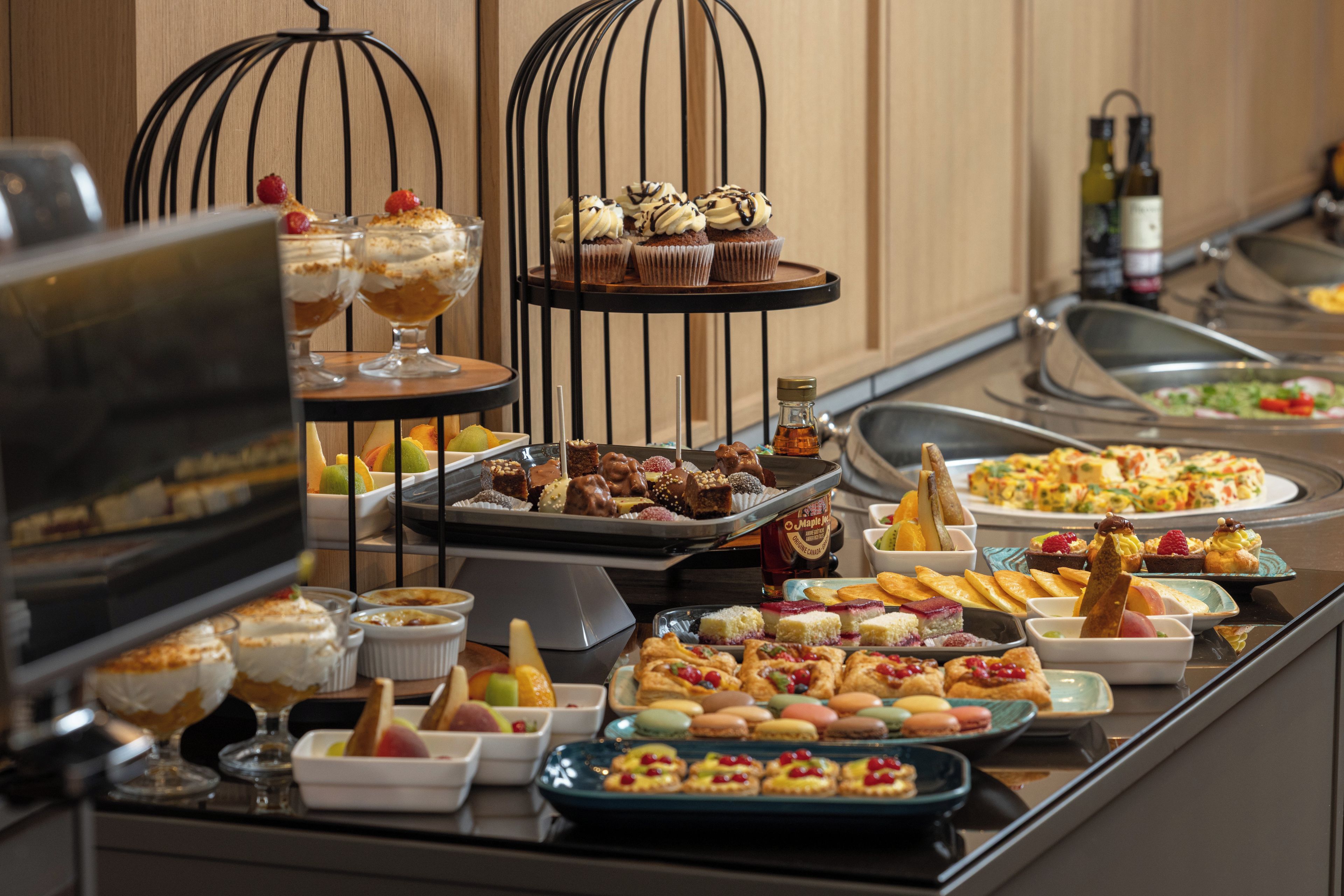 A buffet with a variety of desserts and pastries.