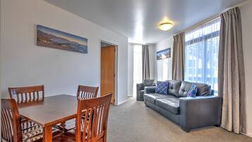 Two Bedroom Spa | Living area | 32-inch TV with satellite channels, DVD player