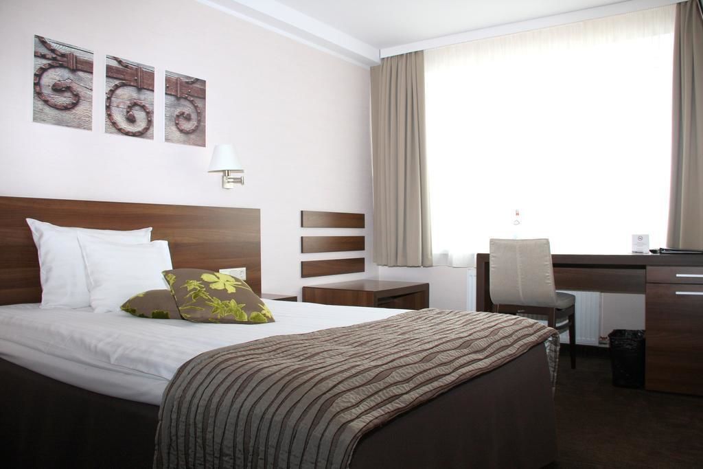 superior room | minibar, in-room safe, desk, iron/ironing board